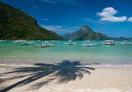 tranquil anchoring outrigger boats in el nido
