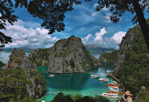 lagoon mountains and boats