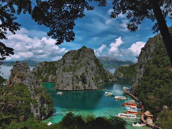 lagoon mountains and boats
