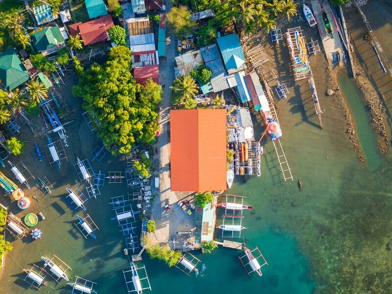 outriggers next to village