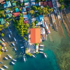outriggers next to village