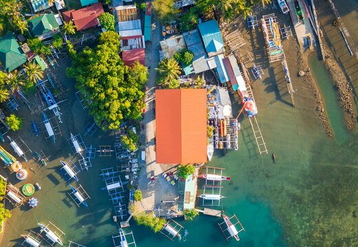 outriggers next to village