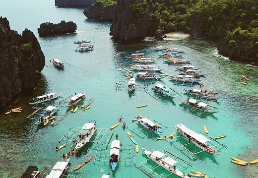 lagoon full with outriggers