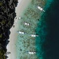 outriggers mooring on a tropical beach