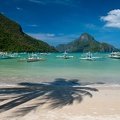 tranquil anchoring outrigger boats in el nido